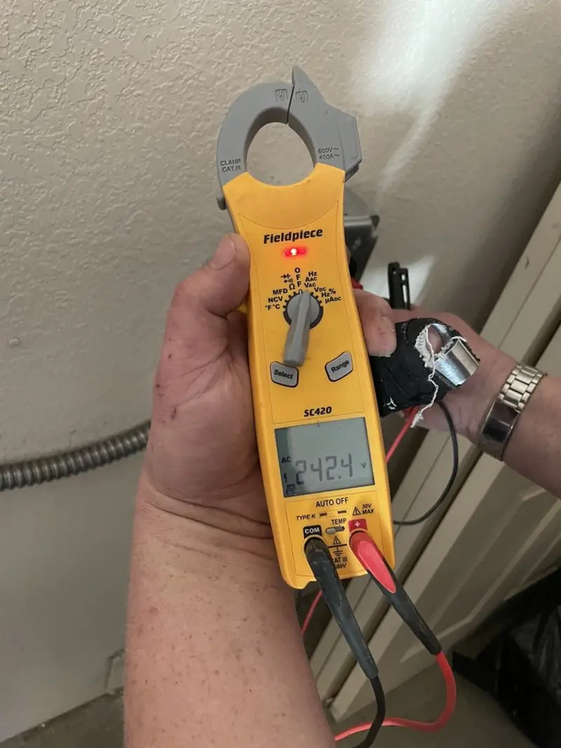 Voltage testing with clamp meter during Recessed Lighting Installation in Sappington